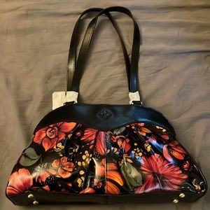 Brand leather Patricia Nash purse. Black with floral. Never worn or used.